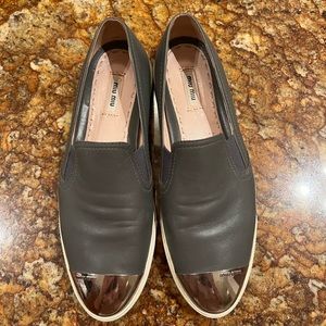 Miu Miu gray leather slide.